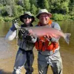 two men displaying their king salmon caught on the talachulitna river with tal-adventures lodge. one of the many talachulitna river fish species