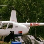 tal adventures lodge helicopter with a nosey bear