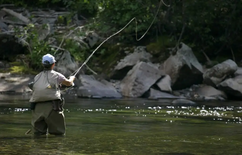 Man fly fishing on his trip to Alaska on a heli-float fishing trip with Tal-Adventures Lodge