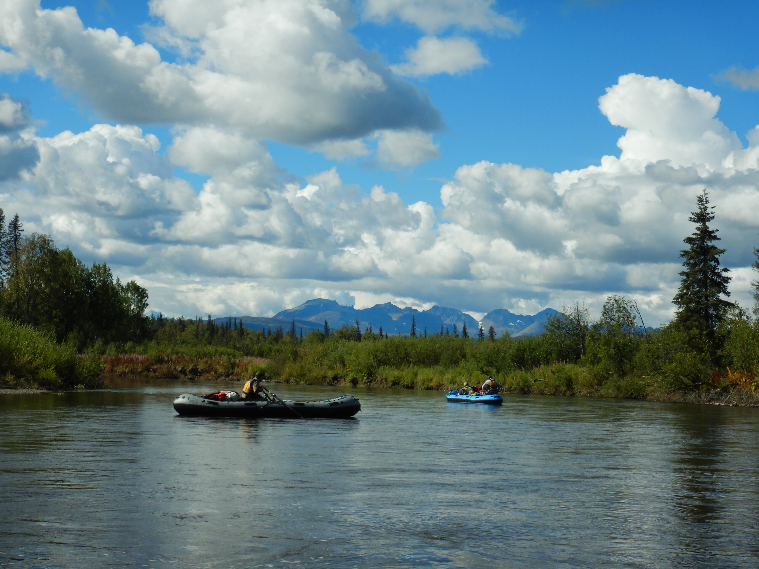 two fisherman floating on the talachulitna river in alaska while fishing