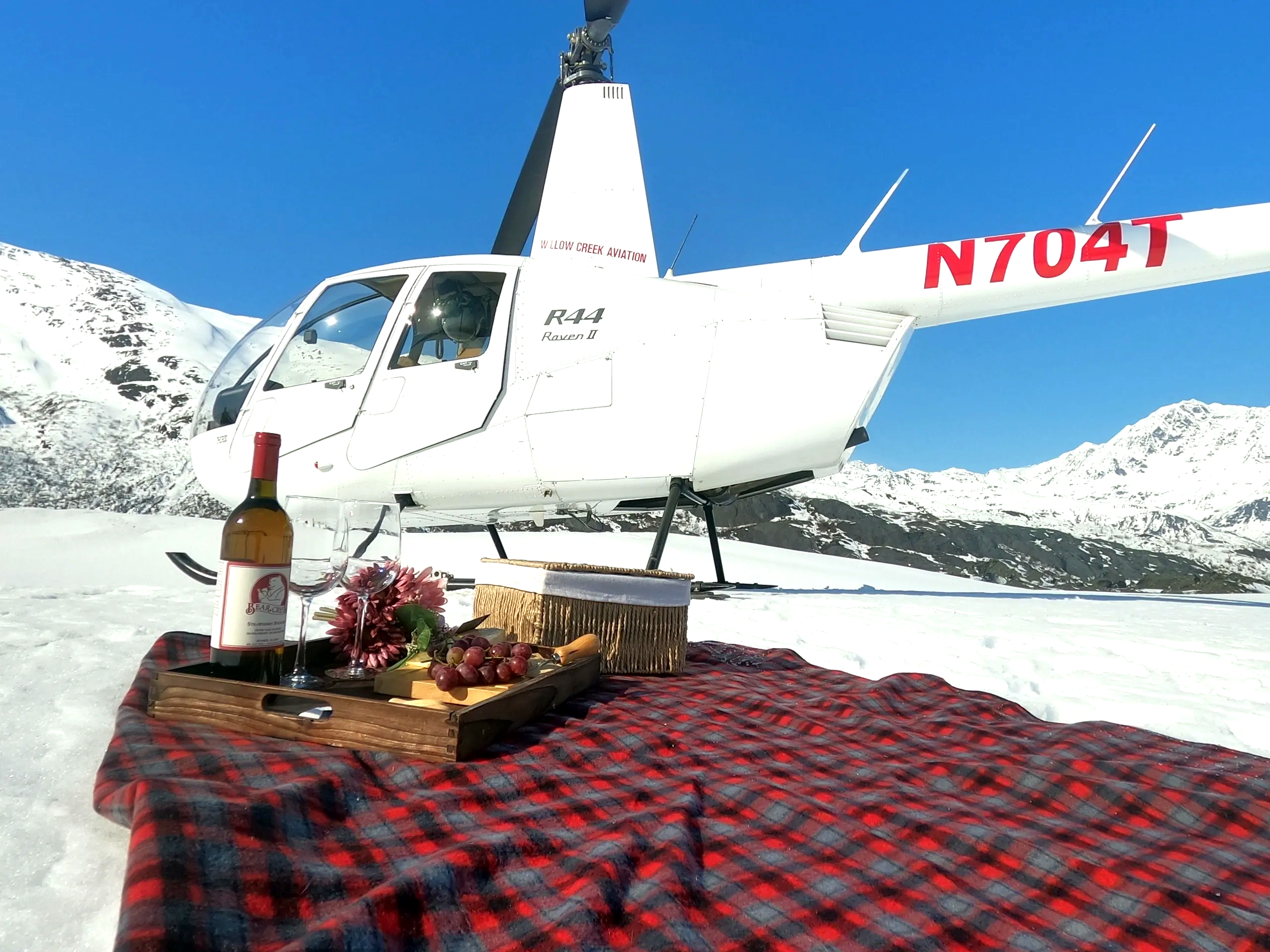 heli tours on the talachulitna river with the tal-adventures lodge shows a heli atop a glacier