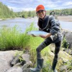 tal-adventure lodge visitor proudly displays her salm caught on the talachulitna river