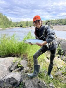 tal-adventure lodge visitor proudly displays her salm caught on the talachulitna river