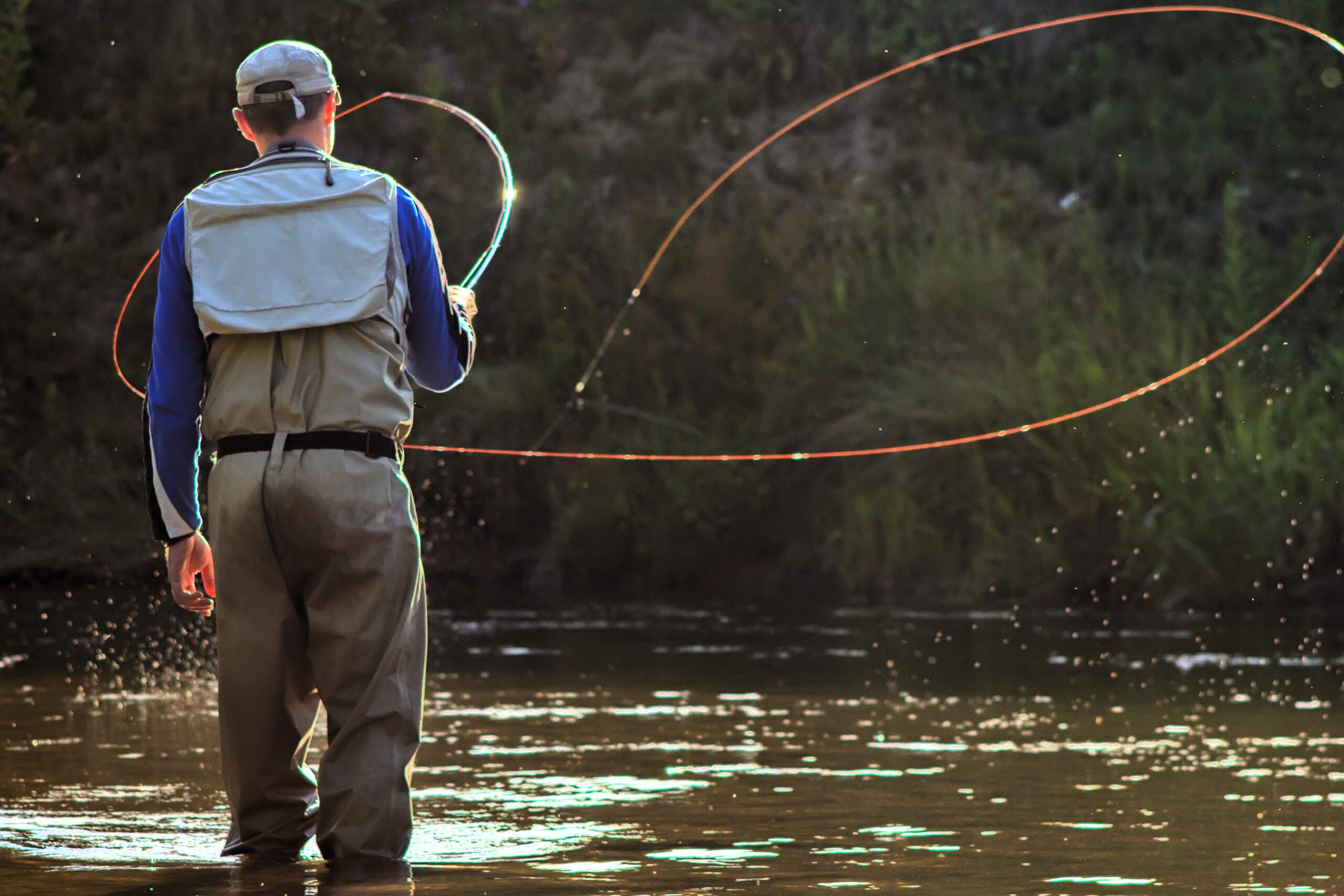 A fisherman fishing with fly fishing. Beautiful cord rings when casting Circle Castes, Voodoo Castes