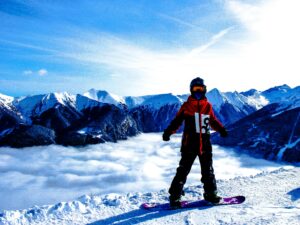 Snowboarded on Snow Covered Mountain