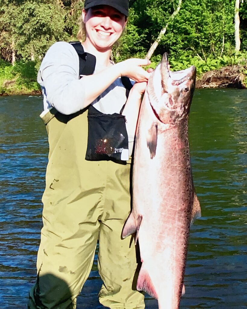 tal river lodge man holding fish he caught with tal-adventures lodge in alaska